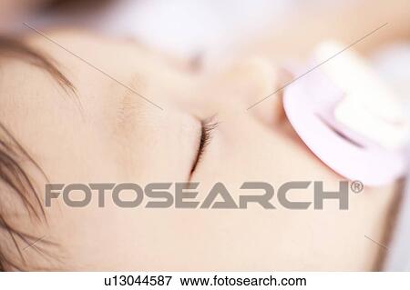 Close-up of baby's face View Large Photo Image Stock Photo - Close-up of baby's face. Fotosearch