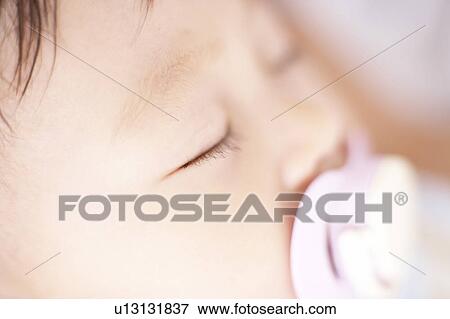 Stock Photo - Close-up of baby's face. Fotosearch