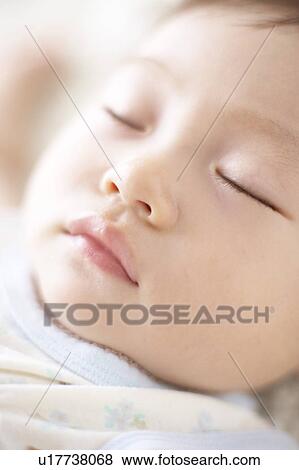 Stock Photo - Close-up of baby's face. Fotosearch