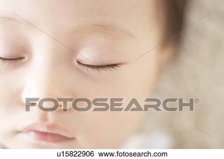 Close-up of baby's face View Large Photo Image Stock Photograph - Close-up of baby's face. Fotosearch