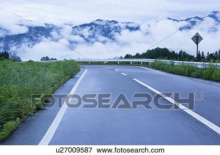Cloudscape and curved road, Nagano Prefecture, Japan View Large Photo Image Stock Photo - Cloudscape and curved road, Nagano Prefecture, Japan. Fotosearch
