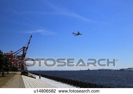 Commercial airplane over water, Tokyo Prefecture, Honshu, Japan View Large Photo Image Stock Image - Commercial airplane over water, Tokyo Prefecture, Honshu, Japan. Fotosearch