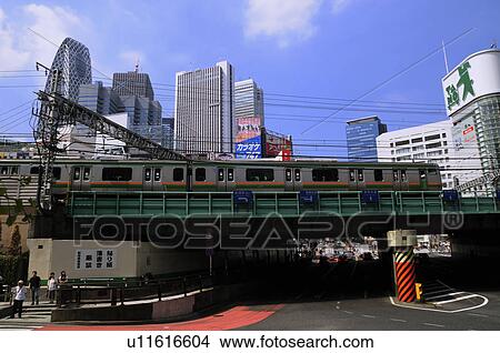 Commuter Train with Skyline in Background View Large Photo Image Picture - Commuter Train with Skyline in Background. Fotosearch