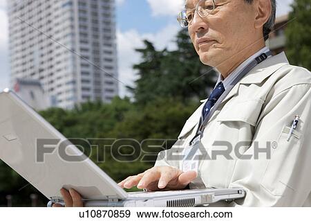 Construction Worker Using Laptop View Large Photo Image Stock Photo - Construction Worker Using Laptop. Fotosearch