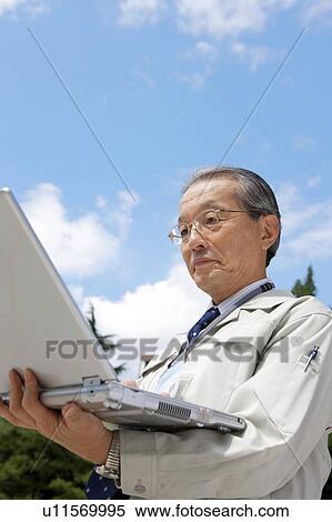 Construction Worker Using Laptop View Large Photo Image Stock Photography - Construction Worker Using Laptop. Fotosearch