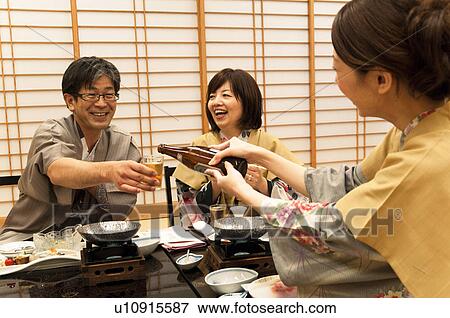 Daughter Pouring Beer For Her Father View Large Photo Image Stock Photo - Daughter Pouring Beer For Her Father. Fotosearch