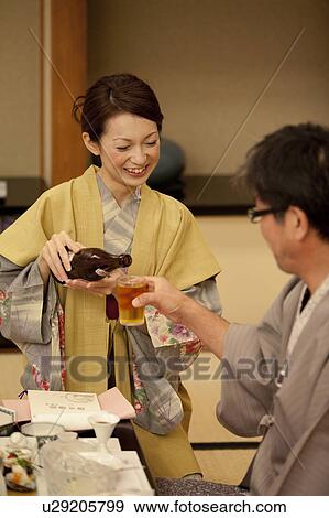 Daughter Pouring Beer For Her Father View Large Photo Image Stock Photo - Daughter Pouring Beer For Her Father. Fotosearch