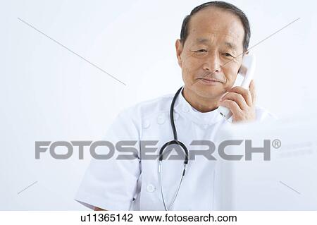 Doctor on Phone View Large Photo Image Stock Image - Doctor on Phone. Fotosearch