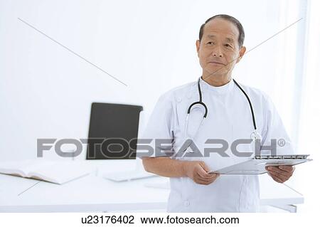 Stock Image - Doctor with Clipboard. Fotosearch