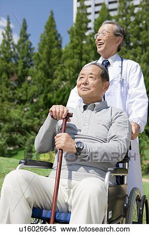 Stock Photography - Doctor with Patient. Fotosearch