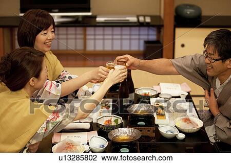 Family of Three Toasting at Dinner View Large Photo Image Stock Image - Family of Three Toasting at Dinner. Fotosearch