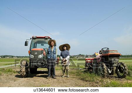 Farmer Couple in Rice Field View Large Photo Image Stock Image - Farmer Couple in Rice Field. Fotosearch