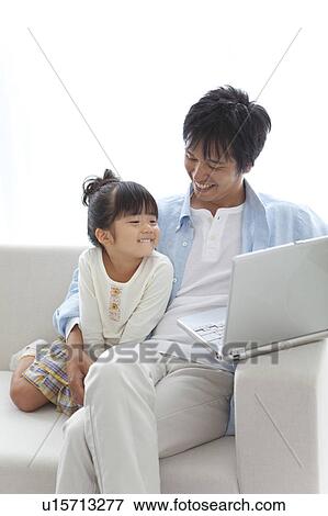 Father and Daughter Using Laptop View Large Photo Image Stock Photo - Father and Daughter Using Laptop. Fotosearch