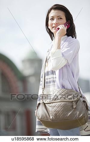 Stock Photo - Female University Student On The Phone. Fotosearch