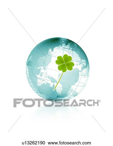 Stock Image - Four-leaf clover and earth. Fotosearch