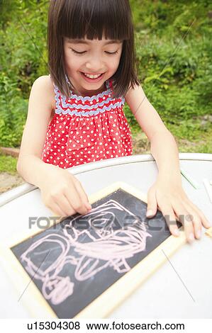 Girl Drawing on Black Board View Large Photo Image Stock Photo - Girl Drawing on Black Board. Fotosearch