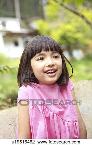 Stock Image - Girl Shrugging Shoulders. Fotosearch