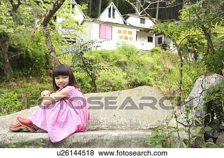Stock Photo - Girl Sitting on Stone Bench. Fotosearch