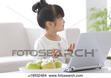 Picture - Girl Using Laptop. Fotosearch