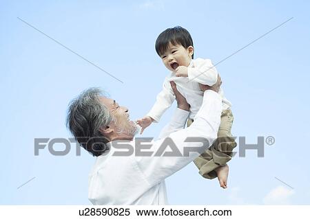 Grandfather Holding Up Grandson View Large Photo Image Stock Photography - Grandfather Holding Up Grandson. Fotosearch