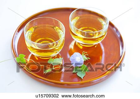 Stock Image - Green tea and morning glory. Fotosearch
