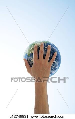 Stock Image - Hand Holding Globe. Fotosearch