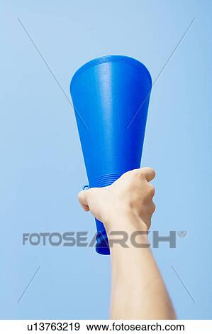 Hand Holding Megaphone Against Blue Sky View Large Photo Image Stock Photo - Hand Holding Megaphone Against Blue Sky. Fotosearch