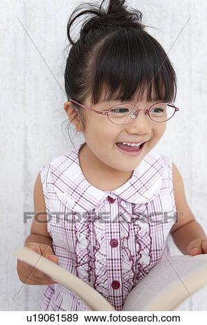 Happy Young Girl with Book View Large Photo Image Stock Photo - Happy Young Girl with Book. Fotosearch
