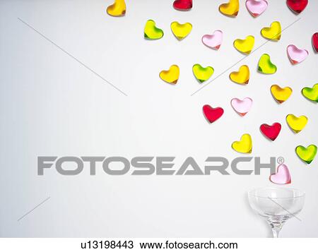 Heart Shaped Sweets Spilling From Wineglass View Large Photo Image Stock Image - Heart Shaped Sweets Spilling From Wineglass. Fotosearch