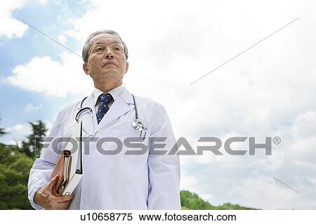 Male Doctor Against Sky View Large Photo Image Stock Photography - Male Doctor Against Sky. Fotosearch