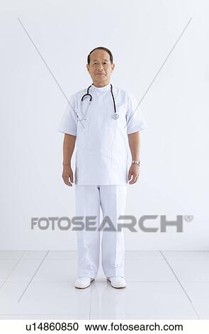 Stock Image - Male Doctor Against White. Fotosearch