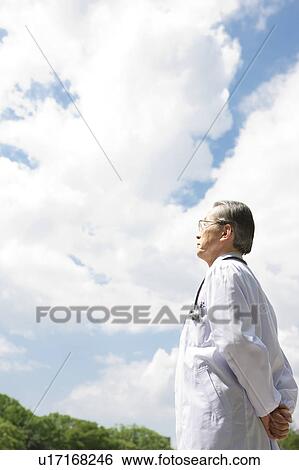 Stock Photograph - Male Doctor Contemplating. Fotosearch