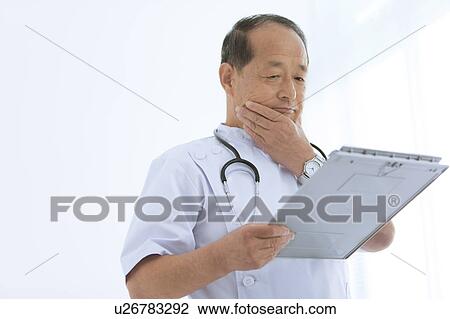 Male Doctor Examining Patient Report View Large Photo Image Stock Image - Male Doctor Examining Patient Report. Fotosearch