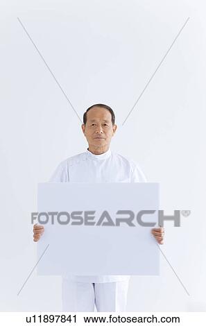 Male Doctor Holding Blank Message View Large Photo Image Stock Image - Male Doctor Holding Blank Message. Fotosearch