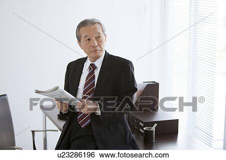 Mature Businessman with Newspaper View Large Photo Image Stock Photograph - Mature Businessman with Newspaper. Fotosearch