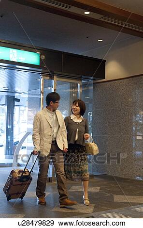 Mature Couple Arriving in Hotel View Large Photo Image Stock Photo - Mature Couple Arriving in Hotel. Fotosearch