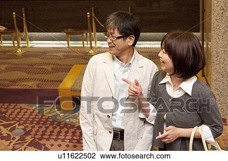 Mature Couple at Hotel Reception, High Angle View View Large Photo Image Stock Image - Mature Couple at Hotel Reception, High Angle View. Fotosearch