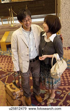 Mature Couple at Hotel Reception, High Angle View View Large Photo Image Stock Photo - Mature Couple at Hotel Reception, High Angle View. Fotosearch