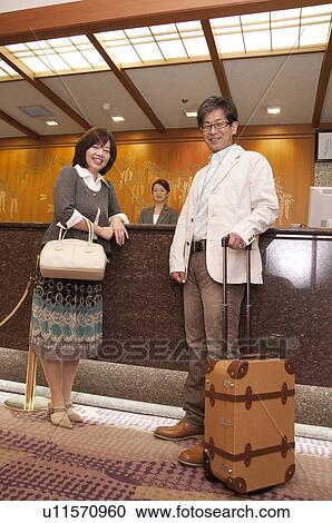 Mature Couple at Hotel Reception View Large Photo Image Stock Image - Mature Couple at Hotel Reception. Fotosearch