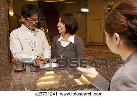Mature Couple at Hotel Reception View Large Photo Image Stock Image - Mature Couple at Hotel Reception. Fotosearch