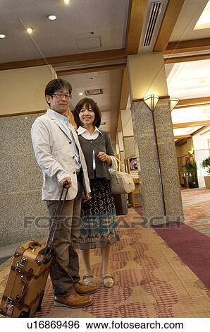 Mature Couple at Hotel Reception View Large Photo Image Stock Photograph - Mature Couple at Hotel Reception. Fotosearch