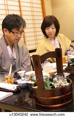Stock Image - Mature Couple Having Dinner. Fotosearch