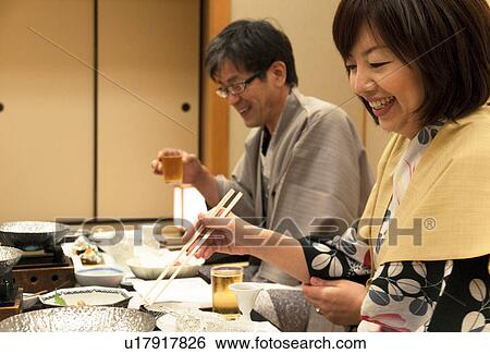 Stock Photograph - Mature Couple Having Dinner. Fotosearch