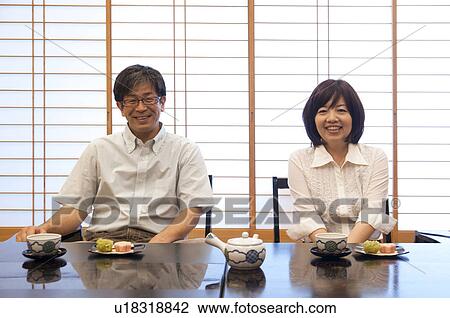 Mature Couple Having Tea and Sweets View Large Photo Image Stock Image - Mature Couple Having Tea and Sweets. Fotosearch