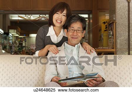Mature Couple in Hotel Lobby View Large Photo Image Stock Photography - Mature Couple in Hotel Lobby. Fotosearch