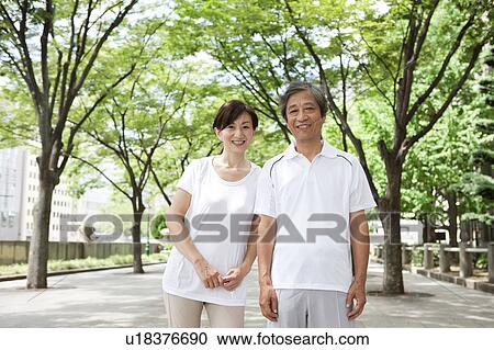 Stock Image - Mature Couple in Park. Fotosearch