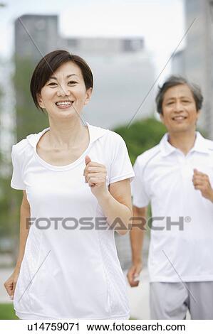 Stock Image - Mature Couple Jogging. Fotosearch