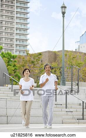 Stock Photograph - Mature Couple Jogging. Fotosearch