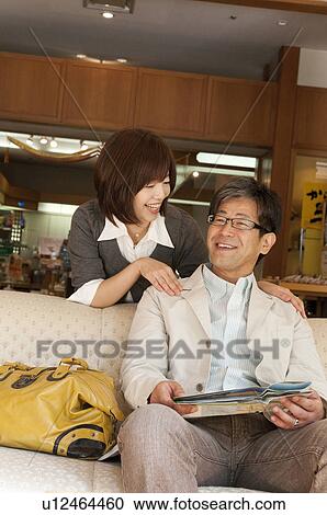 Stock Image - Mature Couple on Sofa. Fotosearch
