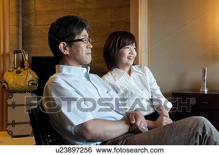 Mature Couple Sitting in Hotel Room View Large Photo Image Stock Photograph - Mature Couple Sitting in Hotel Room. Fotosearch